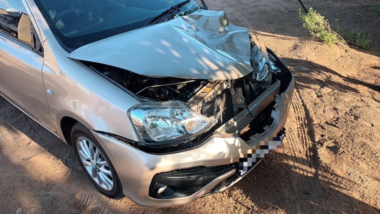 A champagne Toyota Etios with a crushed front end