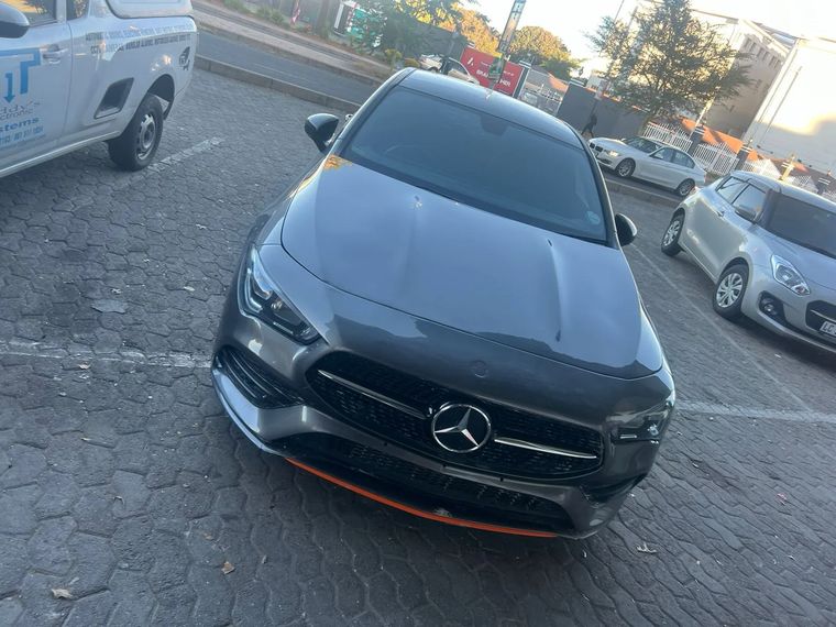 The same Mercedes CLA finished, parked outside