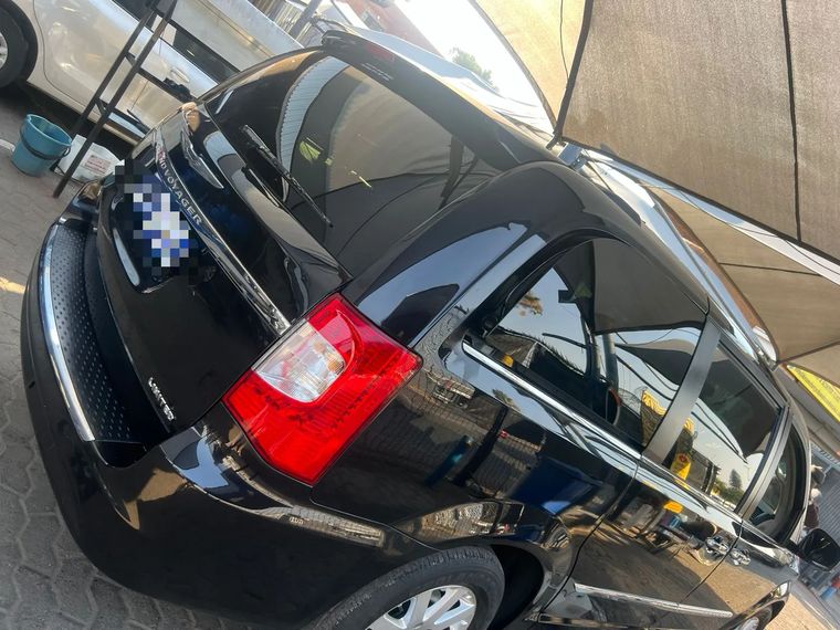 The same black MPV finished in gloss black